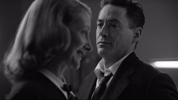 Movie still from “Good Night, and Good Luck.” (2005), directed by George Clooney – A black and white photo of a man and a woman; Close Up shot, Over the shoulder angle