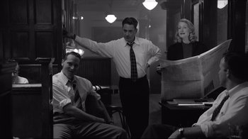 Movie still from “Good Night, and Good Luck.” (2005), directed by George Clooney – A man and a woman standing next to each other in a room; Medium shot, Low angle