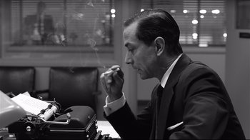Movie still from “Good Night, and Good Luck.” (2005), directed by George Clooney – A black and white photo of a man smoking a cigarette; Close Up shot, Low angle