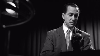 Movie still from “Good Night, and Good Luck.” (2005), directed by George Clooney – An older man wearing a suit and tie; Close Up shot, Low angle