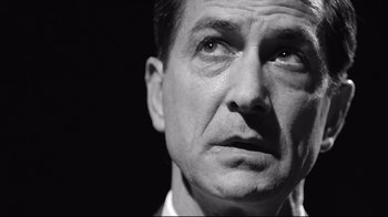 Movie still from “Good Night, and Good Luck.” (2005), directed by George Clooney – Black and white photograph of a man looking into the distance; Close Up shot, Low angle