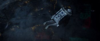 Movie still from “Gravity” (2013), directed by Alfonso Cuarón – An image of an astronaut floating in the water; Extreme Wide shot, Overhead angle