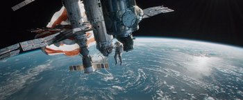Movie still from “Gravity” (2013), directed by Alfonso Cuarón – An image of an astronaut on a spacewalk in space; Extreme Wide shot, Low angle