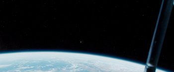 Movie still from “Gravity” (2013), directed by Alfonso Cuarón – A view of the earth taken from the space station; Extreme Wide shot, Overhead angle