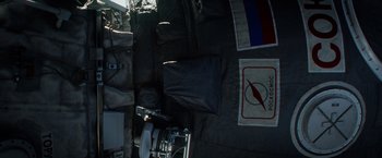 Movie still from “Gravity” (2013), directed by Alfonso Cuarón – View of the inside of an airplane; Wide shot, Overhead angle