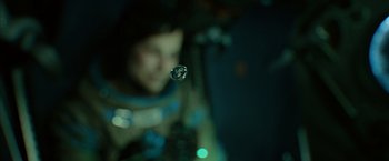 Movie still from “Gravity” (2013), directed by Alfonso Cuarón – A woman is looking at a bubble in the air; Extreme Close Up shot, Low angle