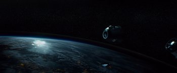 Movie still from “Gravity” (2013), directed by Alfonso Cuarón – An image of a space ship in the sky above the earth; Extreme Wide shot, Overhead angle