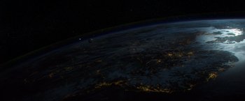 Movie still from “Gravity” (2013), directed by Alfonso Cuarón – An image of an earth from space at night time; Extreme Wide shot, Overhead angle