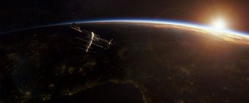 Movie still from “Gravity” (2013), directed by Alfonso Cuarón – An image of an earth from space taken at night; Extreme Wide shot, Overhead angle