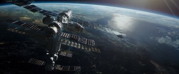 Movie still from “Gravity” (2013), directed by Alfonso Cuarón – A view of the earth from a space station; Extreme Wide shot, Overhead angle