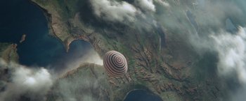 Movie still from “Gravity” (2013), directed by Alfonso Cuarón – An aerial view of a hot - air balloon flying over a lake; Extreme Wide shot, Overhead angle