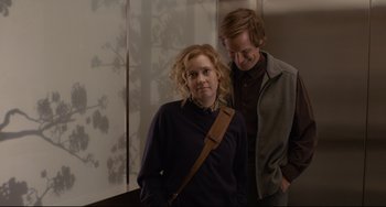 Movie still from “Her” (2013), directed by Spike Jonze – A man and a woman standing next to each other; Medium shot, Over the shoulder angle