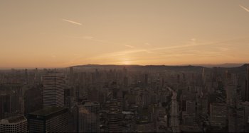 Movie still from “Her” (2013), directed by Spike Jonze – A view of a city skyline at sunset; Extreme Wide shot, High angle