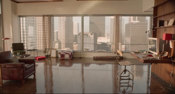 Movie still from “Her” (2013), directed by Spike Jonze – A large room with a view of a large city skyline; Extreme Wide shot, High angle