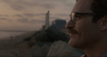 Movie still from “Her” (2013), directed by Spike Jonze – A person wearing glasses; Close Up shot, Over the shoulder angle