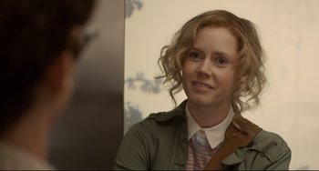 Movie still from “Her” (2013), directed by Spike Jonze – A woman with curly red hair is smiling for the camera; Close Up shot, Over the shoulder angle
