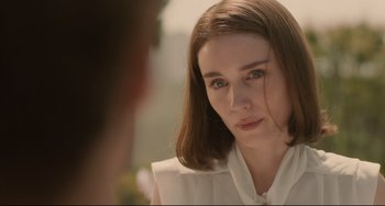 Movie still from “Her” (2013), directed by Spike Jonze – A person looking at the camera; Close Up shot, Over the shoulder angle