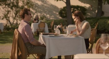 Movie still from “Her” (2013), directed by Spike Jonze – A man and a woman sitting at a table with wine glasses; Medium shot, Over the shoulder angle