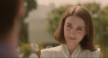 Movie still from “Her” (2013), directed by Spike Jonze – A person wearing a white shirt; Close Up shot, Over the shoulder angle