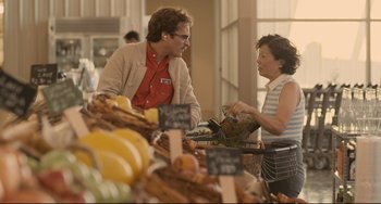 Movie still from “Her” (2013), directed by Spike Jonze – A man and a woman shopping at an outdoor market; Medium shot, Over the shoulder angle