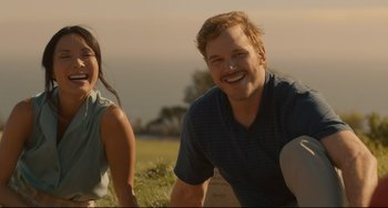 Movie still from “Her” (2013), directed by Spike Jonze – A man and a woman smile for the camera; Medium shot, Over the shoulder angle