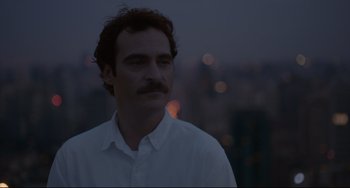 Movie still from “Her” (2013), directed by Spike Jonze – A person wearing a white shirt; Close Up shot, Over the shoulder angle
