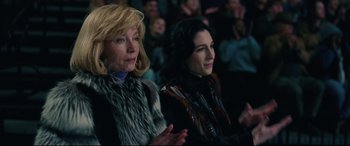 Movie still from “I, Tonya” (2017), directed by Craig Gillespie – Two women sitting in front of a crowd of onlookers; Close Up shot, High angle