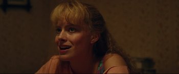 Movie still from “I, Tonya” (2017), directed by Craig Gillespie – A person with long blonde hair; Close Up shot, Over the shoulder angle