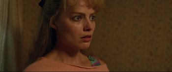 Movie still from “I, Tonya” (2017), directed by Craig Gillespie – A person wearing a pink shirt; Close Up shot, Over the shoulder angle