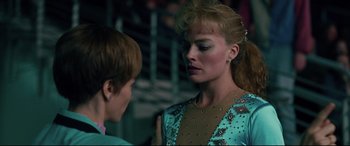 Movie still from “I, Tonya” (2017), directed by Craig Gillespie – A woman in a blue dress talking to a boy in a brown shirt; Close Up shot, Over the shoulder angle