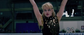 Movie still from “I, Tonya” (2017), directed by Craig Gillespie – A female figure skating skater in a black and gold outfit; Close Up shot, Low angle