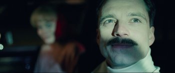 Movie still from “I, Tonya” (2017), directed by Craig Gillespie – A man with a mustache; Close Up shot, Low angle