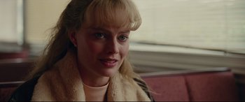 Movie still from “I, Tonya” (2017), directed by Craig Gillespie – A person wearing a scarf; Close Up shot, Over the shoulder angle