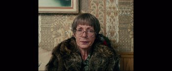 Movie still from “I, Tonya” (2017), directed by Craig Gillespie – An older woman wearing glasses and a fur coat; Close Up shot, High angle