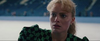 Movie still from “I, Tonya” (2017), directed by Craig Gillespie – A person wearing a checkered shirt; Close Up shot, Low angle