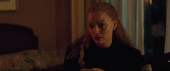 Movie still from “I, Tonya” (2017), directed by Craig Gillespie – A person sitting in front of a window; Close Up shot, Over the shoulder angle