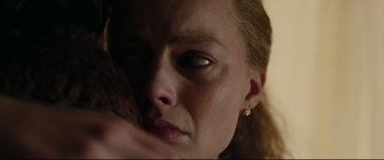 Movie still from “I, Tonya” (2017), directed by Craig Gillespie – A woman's face with her hand on her chin; Extreme Close Up shot, Low angle