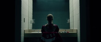 Movie still from “I, Tonya” (2017), directed by Craig Gillespie – A woman sitting in front of a bathroom mirror; Medium shot, Over the shoulder angle