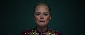 Movie still from “I, Tonya” (2017), directed by Craig Gillespie – A person wearing a red and gold shirt; Close Up shot, High angle