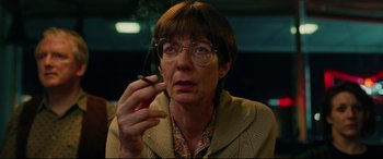 Movie still from “I, Tonya” (2017), directed by Craig Gillespie – A woman smoking a cigarette while wearing glasses; Close Up shot, Low angle