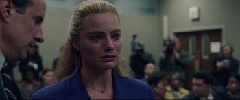 Movie still from “I, Tonya” (2017), directed by Craig Gillespie – A woman with blonde hair wearing a blue jacket; Close Up shot, Over the shoulder angle