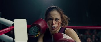 Movie still from “I, Tonya” (2017), directed by Craig Gillespie – A woman wearing boxing gloves with blood all over her face; Close Up shot, Low angle