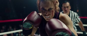 Movie still from “I, Tonya” (2017), directed by Craig Gillespie – A woman wearing boxing gloves with blood on her face; Close Up shot, Low angle