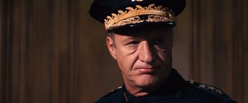 Movie still from “Dirty Harry” (1971), directed by Don Siegel – A person wearing a hat; Close Up shot, Low angle