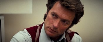 Movie still from “Dirty Harry” (1971), directed by Don Siegel – A person wearing a tie; Close Up shot, Low angle