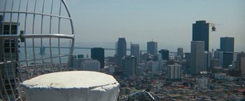 Movie still from “Dirty Harry” (1971), directed by Don Siegel – A view of a large city from the top of a tower; Extreme Wide shot, High angle