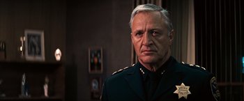 Movie still from “Dirty Harry” (1971), directed by Don Siegel – An older man in a uniform looking at the camera; Close Up shot, Low angle