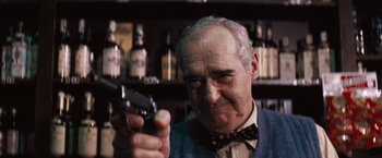 Movie still from “Dirty Harry” (1971), directed by Don Siegel – An older man holding a gun in his hand; Close Up shot, Low angle