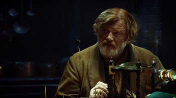 Movie still from “In the Heart of the Sea” (2015), directed by Ron Howard – An old man with a beard and a long beard; Medium shot, Over the shoulder angle