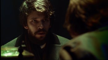 Movie still from “In the Heart of the Sea” (2015), directed by Ron Howard – A person looking at a mirror; Close Up shot, Over the shoulder angle